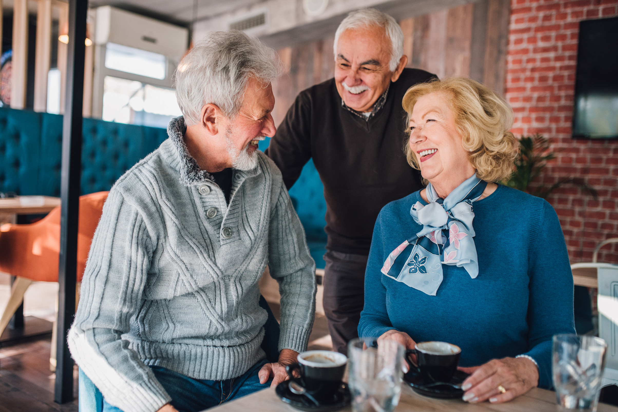 Older people laughing at Cafe